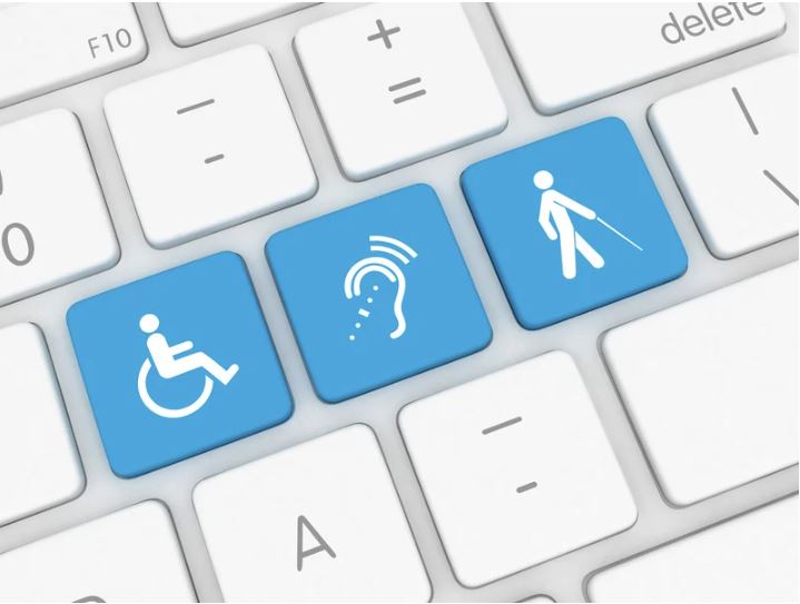 keyboard with three blue buttons of accessible symbols, such as the wheelchair, hard of hearing symbol, and assistive walking